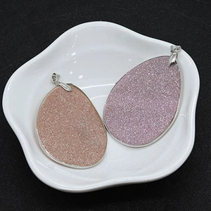 Pink and champagne teardrop shell pendants with frosted glitter finish and silver pinch bails