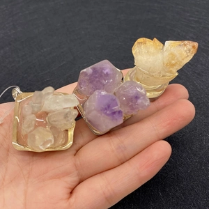 Natural raw crystal cluster pendants in purple, yellow, and white with square metal base