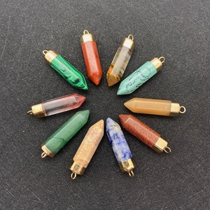 Set of 10 hexagonal natural stone cone pendants with gold metal bails on black background