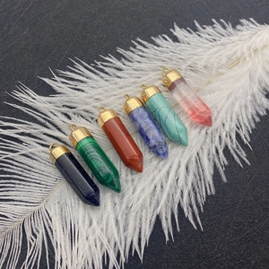 Set of six colorful hexagonal natural stone pendants with gold plated bail on white feather