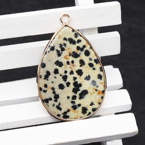 Dalmatian jasper teardrop pendant with gold-plated edge and top metal connector
