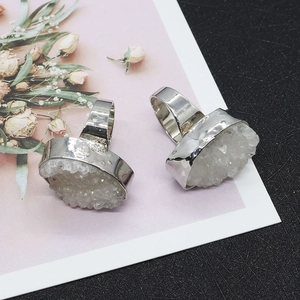 Oval white druzy natural stone rings with silver plated edges on floral card