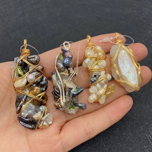 Handcrafted irregular pearl and raw stone pendant with wire wrapped artistic design