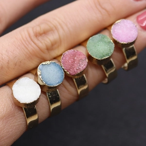Set of five natural druzy quartz rings in various colors with golden adjustable bands