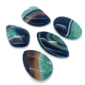 Five pieces of polished natural striped agate stone pendants in various geometric shapes