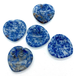 Set of five heart-shaped natural blue sodalite stones with polished smooth surface