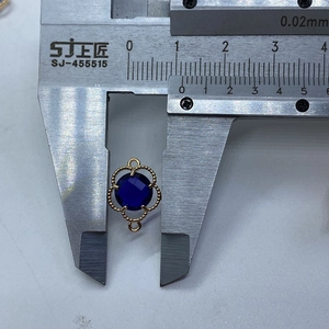 Detailed macro view showing the 8.5mm width of the faceted purple gemstone floral pendant