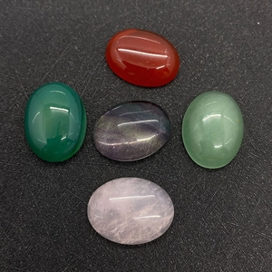 Detailed view of oval polished semi-precious gemstones in varied natural colors