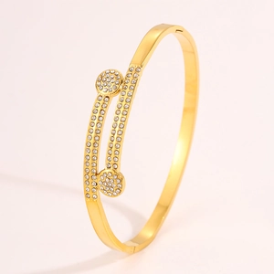 Macro view of double-layered gold titanium steel bracelet with sparkling micro-pave zircons