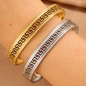 Minimalist stainless steel meander pattern bracelets in gold and silver finish for couples