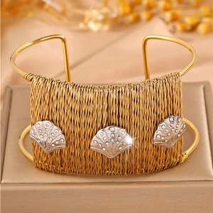 Braided gold titanium steel open bangle with crystal-encrusted seashell charms