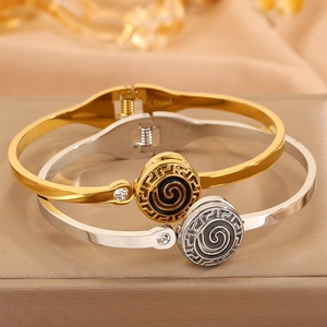 Stainless steel bangle with Greek key pattern and crystal inlay in gold and silver finish