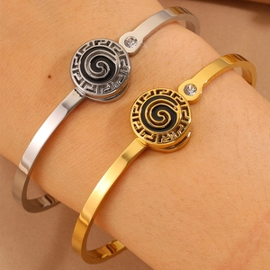 Luxe stainless steel open bangle with meander pattern and black enamel detail for women