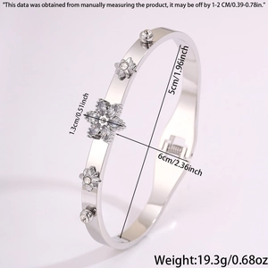 Detail view of silver stainless steel star bangle with dimensions and spring closure