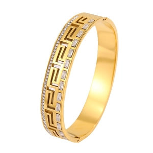 Golden stainless steel bangle with Greek key motif and sparkling crystal inlay