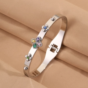 Detail of clover bracelet with colorful pear-cut gemstones and spring clasp closure