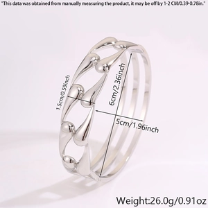 Detail view of silver hollow water drop link bangle with dimensions and metallic texture