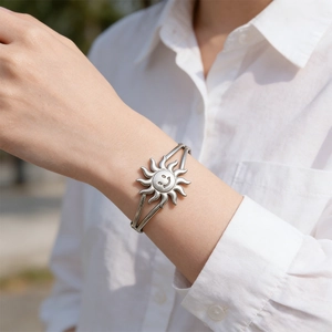 Silver vintage sun smiley face stainless steel open cuff bracelet on female wrist