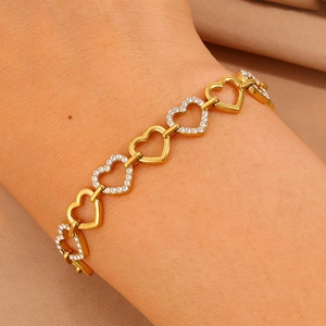 Elegant gold-plated titanium steel bracelet featuring hollow and crystal heart links