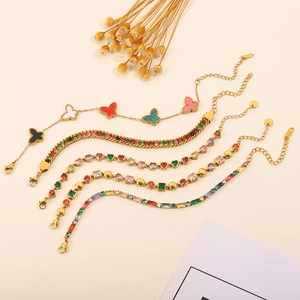 Detailed view of five gold-plated titanium steel bracelets with colorful zircon and charms
