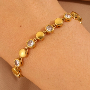 Detailed macro shot of 18K gold plated zircon bracelet with circular geometric links