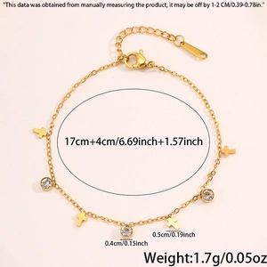 Detailed view of titanium steel bracelet with gold cross charms and zircon accents