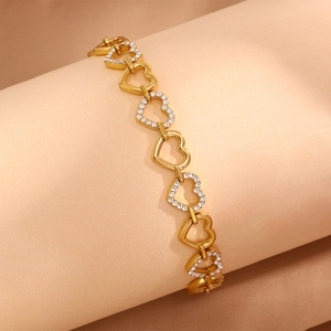 Elegant gold titanium steel heart link bracelet with sparkling cubic zirconia stones