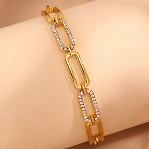 Detail of 18k gold plated oval link bracelet with shimmering rhinestone pavé settings