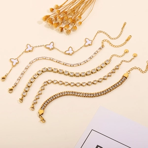 Detail of five gold-plated charm bracelets with butterfly, zircon, and heart elements