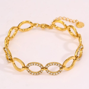 Detailed view of adjustable gold-plated chain bracelet with cubic zirconia set links