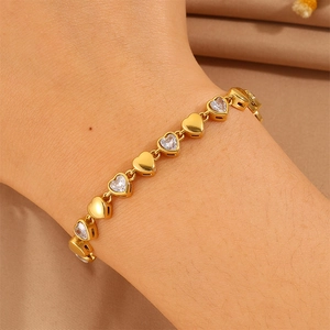 Close-up of 18k gold-plated stainless steel heart link bracelet with cubic zirconia
