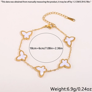 Close-up of golden stainless steel butterfly bracelet with lobster clasp and chain