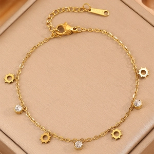 Elegant gold titanium steel bracelet with sparkling sun charms and cubic zirconia accents
