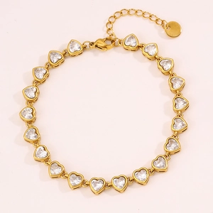 Detailed view of gold heart bracelet with clear cubic zirconia and adjustable chain