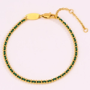 Detail of red braided string bracelet with gold beads and adjustable lobster clasp closure