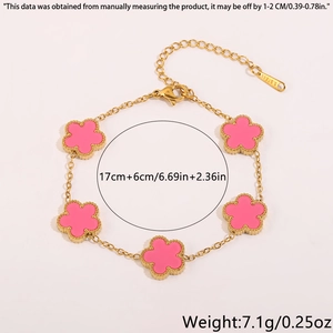 Detailed size view of a gold-tone steel bracelet with five pink floral charms and lobster clasp