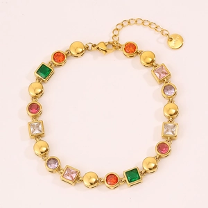 Detail of colorful cubic zirconia gold chain bracelet with lobster clasp and tag