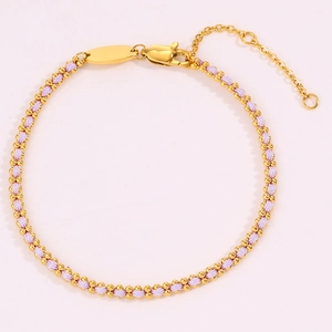 Detailed macro view of a 18k gold-plated bead and lavender woven cord bracelet with clasp