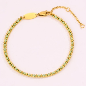 Detail of light green braided silk bracelet with gold metal beads and adjustable clasp