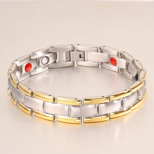 Macro detail of bicolour gold-silver magnetic therapy bracelet in stainless steel