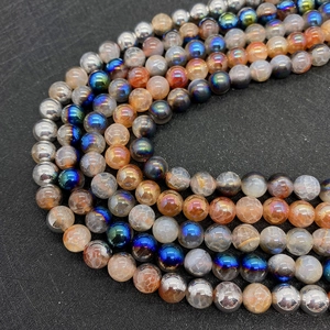 Macro detail of multi-colored crackle agate beads and metallic DIY jewelry components
