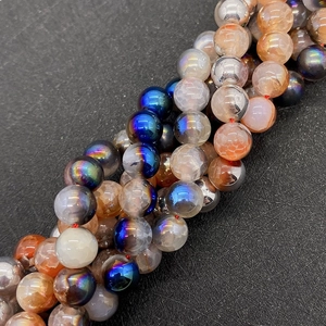 Macro detail of crackle agate and iridescent plated beads for DIY jewelry making