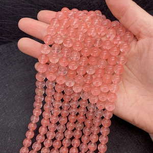 Macro shot of 8-10mm pink watermelon quartz beads with natural textures for jewelry making