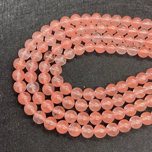 Macro shot of polished pink watermelon crystal round beads for DIY jewelry making