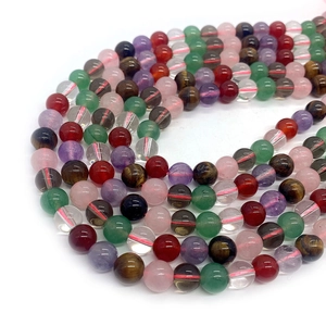 Macro shot of assorted 6mm to 10mm natural crystal tiger eye and agate beads for jewelry DIY