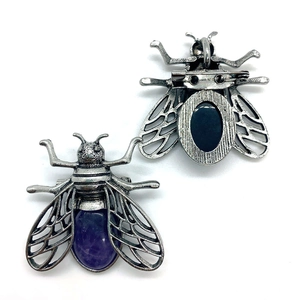 Vintage insect pendant with purple gemstone inlay and filigree wings in silver finish