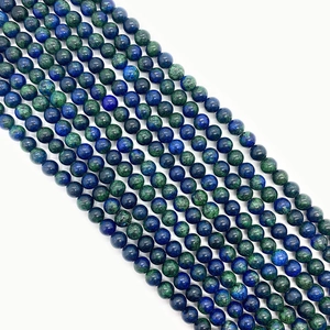 Polished natural azurite and malachite round beads arranged in diagonal rows