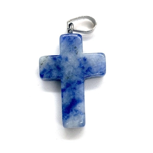Macro shot of polished blue and white natural stone cross pendant with silver metal bail