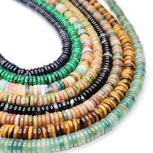 Detailed macro view of natural gemstone heishi beads in various polished minerals
