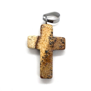 Detail of natural Picture Jasper cross pendant showing unique earthy stone texture